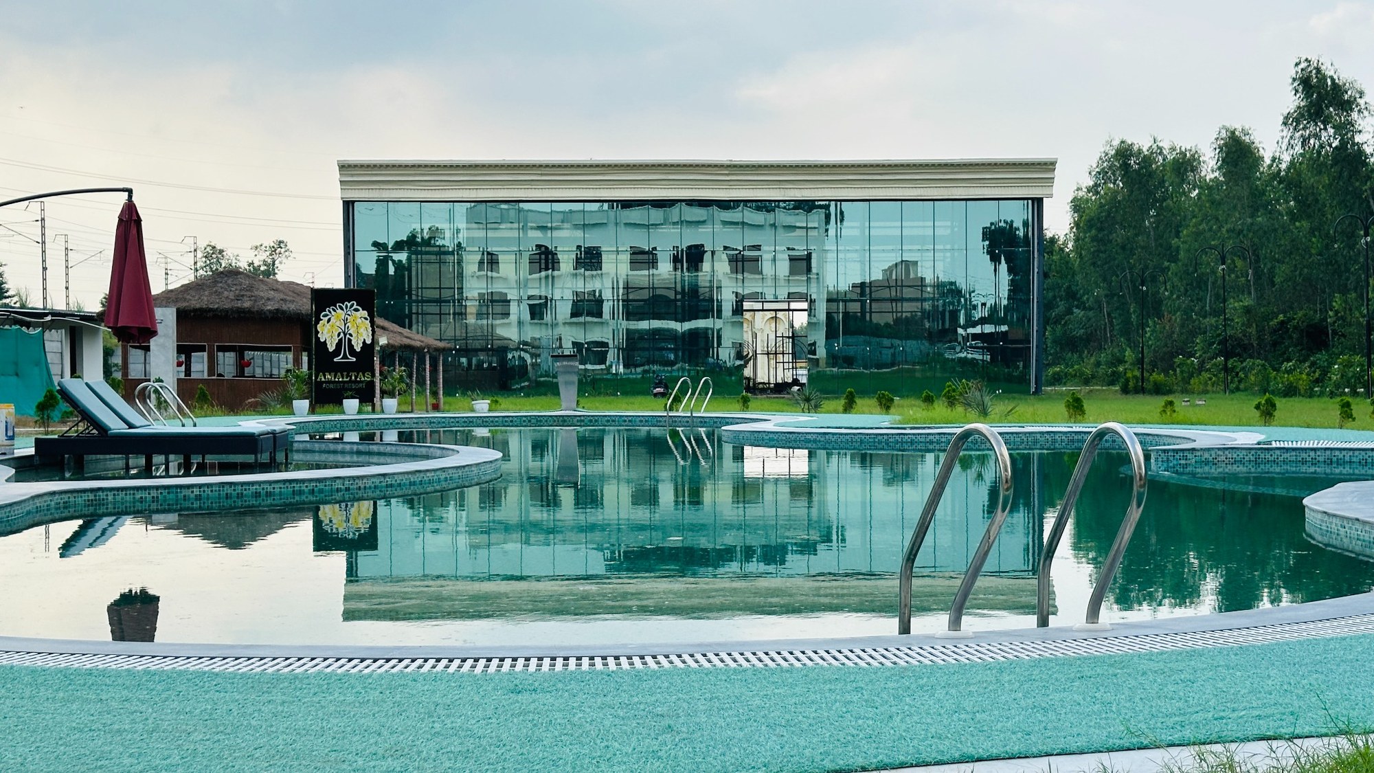Modern glass-front building at Amaltas Forest Resort